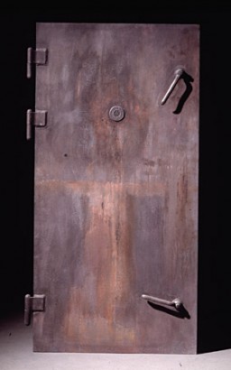 This casting of a gas chamber door in the Majdanek camp, near Lublin, Poland, was commissioned by the United States Holocaust Memorial Museum. Each gas chamber in Majdanek was fitted with an airtight metal door and was bolted shut before gas entered the chamber inside. SS guards could observe the killing process through peepholes in the upper center of the door.