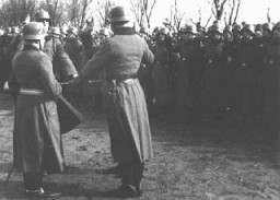 In front of his unit, a soldier takes the oath of loyalty to Adolf Hitler. After President von Hindenburg's death in 1934, all armed service personnel were required to swear an oath to Hitler. Germany, January 1939.