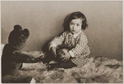 Photograph taken in December 1932 of Suse Grunbaum at age one. Soon after Hitler's 1933 seizure of power in Germany, two-year-old Suse and her parents fled to the Netherlands and settled in the town of Dinxperlo. In 1943, Jews in German-occupied Dinxperlo were ordered to assemble for deportation. Hearing of these plans, the Grünbaums went into hiding, finding refuge with Dutch farmers. The Hartemink family hid Suse and her mother for two years in their barn, first under the floorboards, then in a specially constructed hiding space.