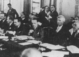 Scene during the Evian Conference on Jewish refugees. On the far right are two of the US delegates: Myron Taylor and James McDonald of the President's Advisory Committee on Political Refugees. Evian-les-Bains, France, July 1938.