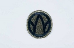 Insignia of the 89th Infantry Division. The 89th Infantry Division's nickname, the "Rolling W," is based on the division's insignia. Created during World War I, this insignia utilized a letter "M" inside a wheel. When the wheel turns, the "M" becomes a "W." The letters "MW" signify the mid-west origin of the troops who formed the 89th during World War I. The division was also known as the "Middle West" division, another variation on its origin.