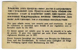 Back side of an entry pass to the court building at the International Military Tribunal. This pass was issued to a U.S. military guard. The pass is printed in each of the IMT's four official languages.