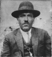 Portrait of David Aruti, son of Isak Aruti. He was a merchant and lived at Zvornitska 26 in Bitola.
This photograph was one of the individual and family portraits of members of the Jewish community of Bitola, Macedonia, used by Bulgarian occupation authorities to register the Jewish population prior to its deportation in March 1943.