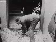 Shortly after the German occupation of Belgrade, Yugoslavia, in April 1941, the Germans forced Jews to clear the rubble caused by the heavy bombardment of the city. This German newsreel footage shows Jews clearing some of the rubble. Most of the city's Jews were later arrested and interned in camps. The German army later shot the Jewish men in retaliation for Serb resistance; the Germans killed the Jewish women and children in gas vans. Only about 2,200 Jews of Belgrade returned to the city after the war.