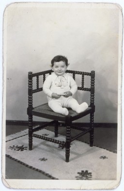 Portrait of Tsewie Herschel seated in a chair, taken while he was living in hiding. [LCID: 58189]
