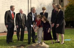 Benjamin Meed, Elie Wiesel (second and third from left), and two children bury a time capsule during the Tribute to Holocaust Survivors: Reunion of a Special Family, one of the Museum's tenth anniversary events. Washington, DC, November 2003.