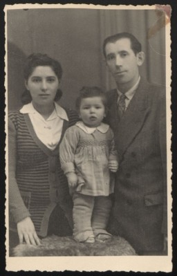 Szyja Faktor, his wife Sala, and their daughter Frieda pose for a photograph while living in the Rivoli displaced persons (DP) camp in Italy, circa 1947–1948. During the war, Szyja, a Polish citizen, had briefly been held by the Germans. He escaped to the Soviet Union, where he stayed until 1945.  