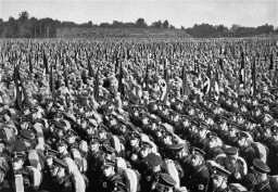 Members of the SA and SS stand in formation during Reichsparteitag (Reich Party Day) ceremonies in Nuremberg, Germany, 1933.