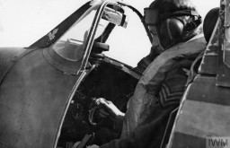 A sergeant pilot of the British Royal Air Force sits in the cockpit of his Spitfire in September 1940. Between July 10 and October 31, 1940, Germany and Britain fought for air control of the English Channel in the Battle of Britain. IWM (HU 104502)