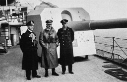 Hitler inspects a German naval warship. On his left is Admiral Erich Raeder. Standing to the right of Hitler is most likely Captain Hermann von Fischel, commander of the Deutschland from April 1, 1933, to December 29, 1935. Bremerhaven, Germany, circa 1933–1935.