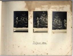 Page from Karl Höcker's album, with the caption "Yuletime, 1944." The photographs show Karl Höcker lighting the candles on the Yule tree. 1944.