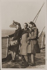 <p>Rozalia (Krysia Laks) Lerman, Miles Lerman, and Regina Laks stand on the deck of the <em>Marine Perch</em> while en route to the United States. January 1947.</p>