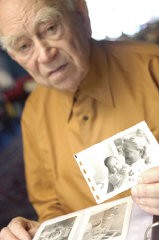 Norman Salsitz holds a photograph of his wife, Amalie, and daughter, Esther. 2004.
With the end of World War II and collapse of the Nazi regime, survivors of the Holocaust faced the daunting task of rebuilding their lives. With little in the way of financial resources and few, if any, surviving family members, most eventually emigrated from Europe to start their lives again. Between 1945 and 1952, more than 80,000 Holocaust survivors immigrated to the United States. Norman was one of them. 