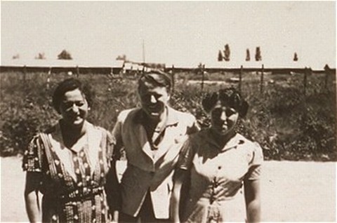 A woman (right) imprisoned in the Gurs camp stands with two Quaker delegates who worked for the American Friends Service Committee.