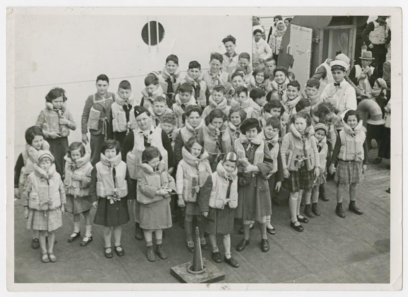 Austrian Jewish children being transported to the United States by Eleanor and Gilbert Kraus perform a life jacket drill aboard the ... [LCID: 76117]