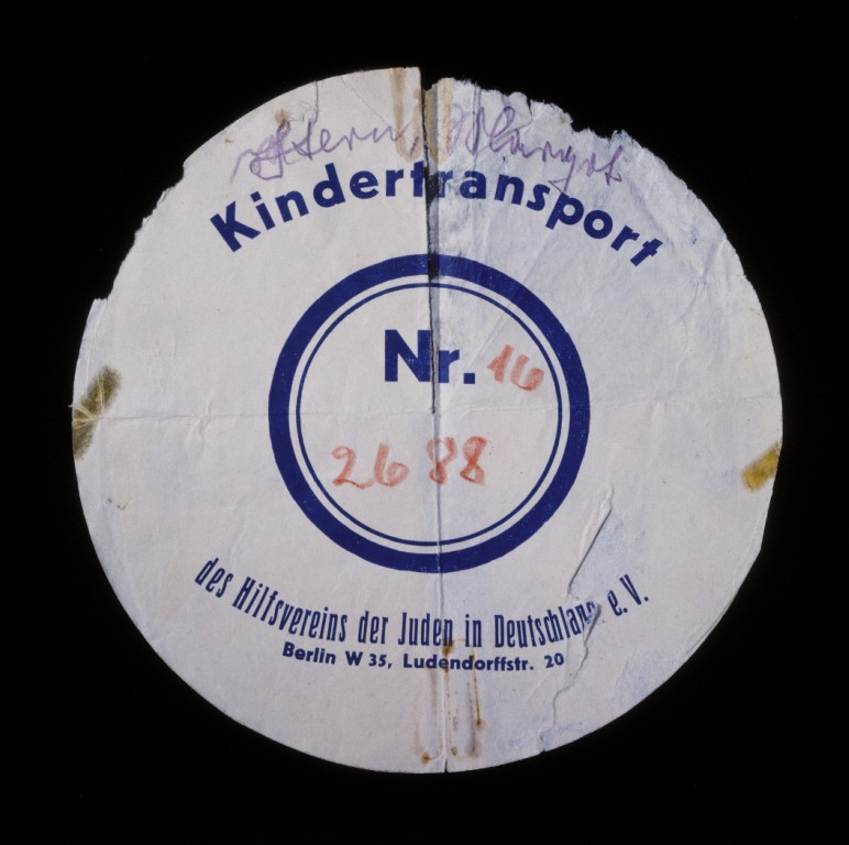Circular label from the suitcase used by Margot Stern when she was sent on a Kindertransport to England. [LCID: n02805]