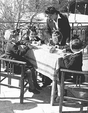 Some of the Polish Jewish refugee children known as the "Tehran Children" with an instructor after their arrival in Palestine.