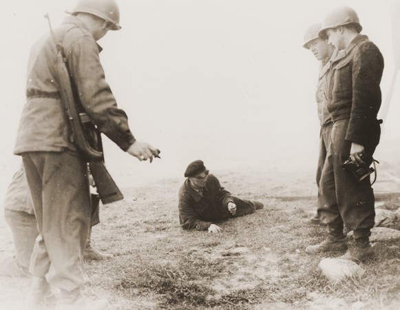 Bonde Gaza, a Hungarian musician who survived the Gardelegen atrocity, demonstrates to American soldiers how he managed to escape ... [LCID: 81373]