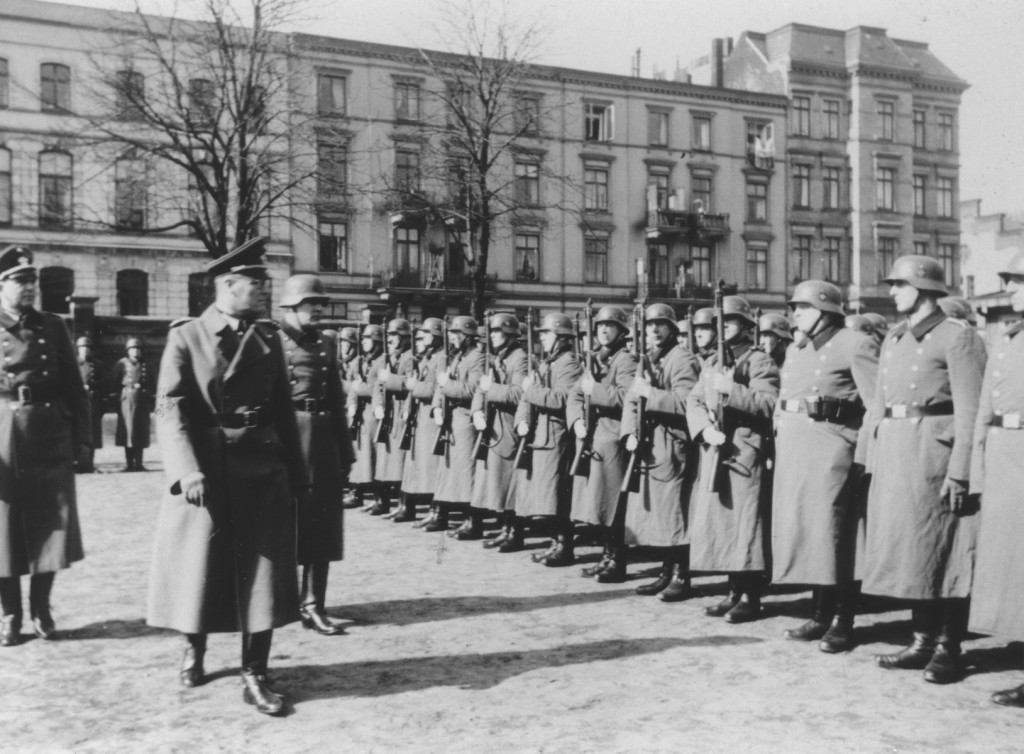 German Order Police officers inspect members of Police Battalion 101 in Lodz after the German occupation of Poland, 1939–1943.