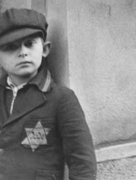 A Jewish boy wearing the compulsory Star of David.