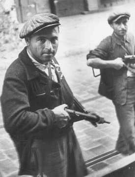 Two partisans during the uprising before liberation. [LCID: 63700]
