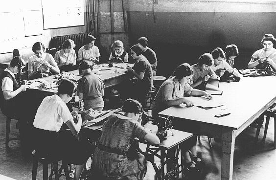 Girls in a sewing class at the Adas Israel school, maintained by the German Jewish community. [LCID: 76818]