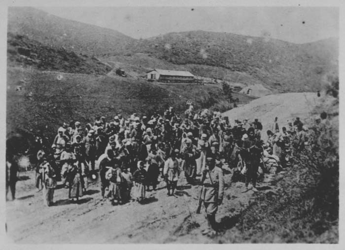 Ottoman troops guard Armenians being deported. Ottoman Empire, 1915-16. [LCID: 93740]