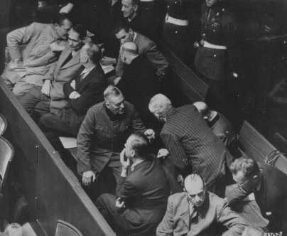 The defendants' box at the Nuremberg trial. Hermann Göring is seated at the far left of the first row. [LCID: 81920]