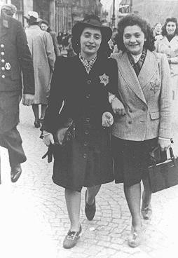 Rozetta Lezer Lopesdias-Van Thyn, left, and a friend, with the compulsory Star of David on their clothing.
