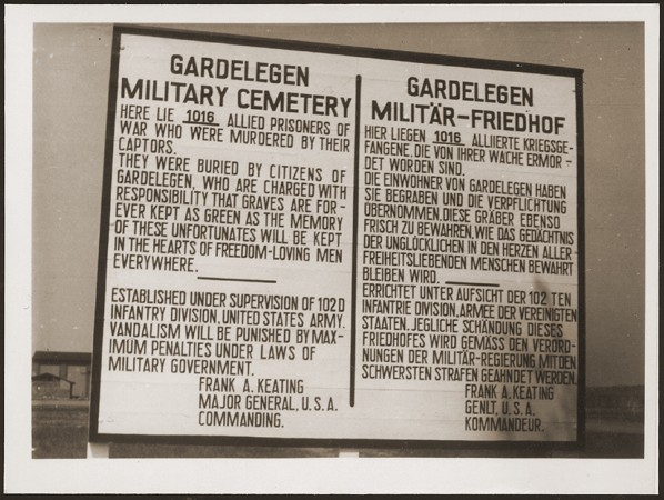 A sign at the military cemetery in Gardelegen in memory of the prisoners who were killed by the SS in a barn near the town. [LCID: 16535]