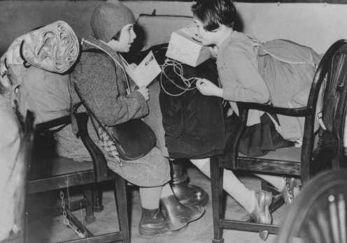 Two Austrian refugee children, part of a group of predominantly Jewish refugee children on a Children's Transport (Kindertransport), upon their arrival in Great Britain.