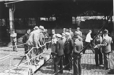 Belgian officials at the gangplank of the "St. Louis" after the ship was forced to return to Europe from Cuba. [LCID: 02975]