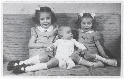 Eva, Alfred, and Leane Munzer. Infant Alfred survived in hiding; his sisters were discovered and killed in Auschwitz. [LCID: 94488]
