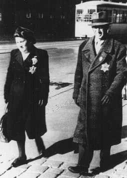 A Jewish couple wearing mandatory Jewish badges. Germany, September 27, 1941.