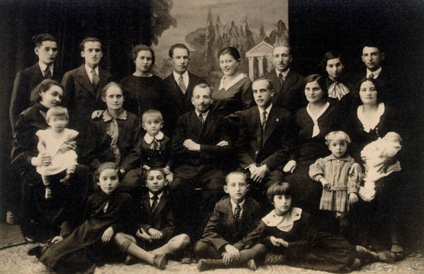 Portrait of Aron's family on his mother's side, taken when Aron's cousin moved to Israel in 1933-1934. [LCID: derm4]