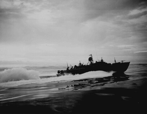 An American PT (Patrol Torpedo) boat off the coast of New Guinea, during an American counteroffensive against Japanese advances in the Solomon Islands in the eastern Pacific Ocean, 1943.
