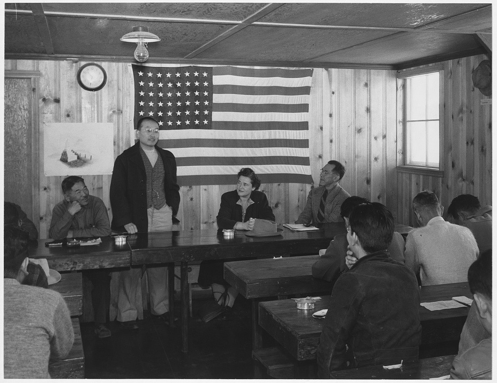 Japanese Americans hold a town hall meeting at the Manzanar Relocation Center in California, 1943.