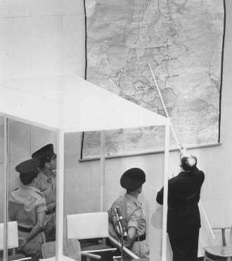 Defendant Adolf Eichmann identifies the city of Danzig (Gdansk) on a map during his trial in Jerusalem. [LCID: 65288]