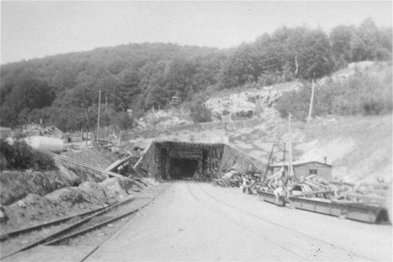 View of a tunnel entrance to the rocket factory at the Dora-Mittelbau concentration camp, near Nordhausen. [LCID: 01276]