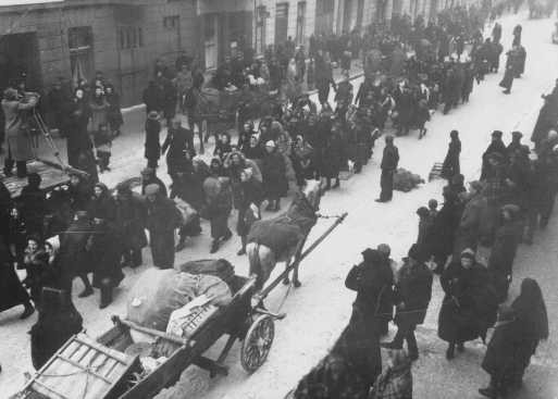 Jews deported from Germany and Austria march towards the Lodz ghetto. [LCID: 70380]