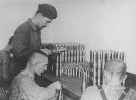 Prisoners work in an armaments factory. Dachau concentration camp, Germany, between 1940 and 1945. [LCID: 46483a]