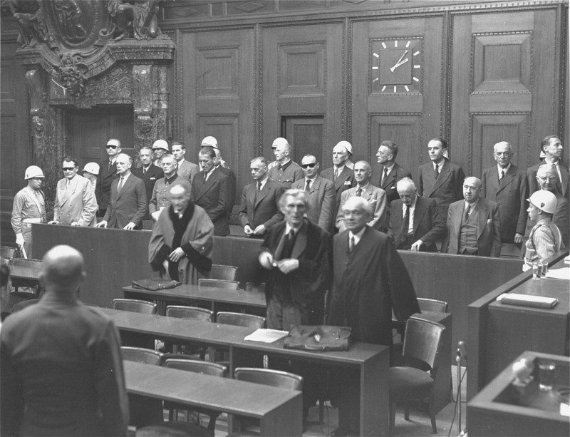 The defendants rise as the judges enter the courtroom at the International Military Tribunal trial of war criminals at Nuremberg. [LCID: 03548]