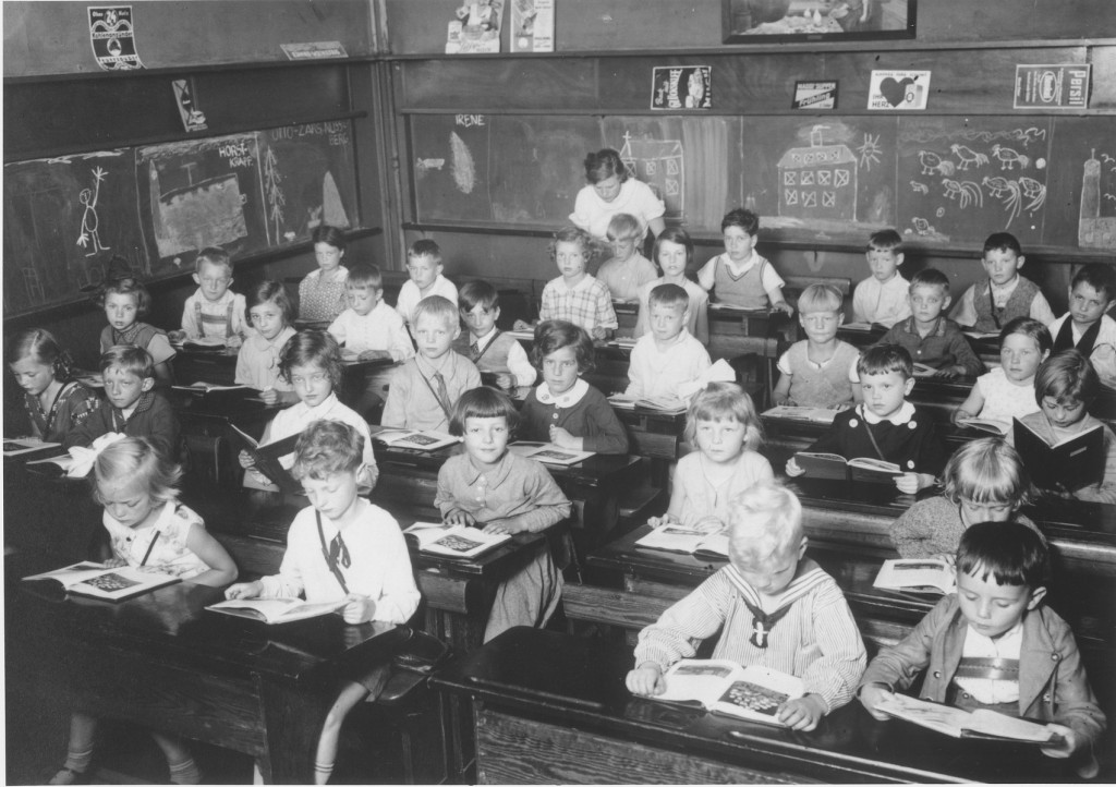 First grade pupils, both Jewish and non-Jewish, study in a classroom in a public school in Hamburg. Germany, June 1933.