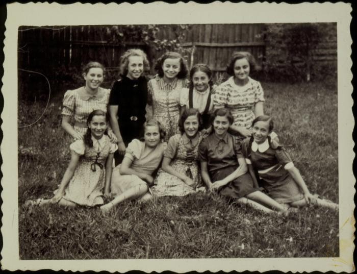 A group of young girls poses in a yard in the town of Ejszyszki (Eishyshok). The Jews of this shtetl were murdered by the Einsatzgruppen on September 21, 1941. Photo taken before September 1941.
