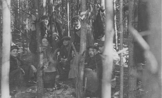 Jewish partisans, survivors of the Warsaw ghetto uprising, at a family camp in Wyszkow forest. [LCID: 85452]