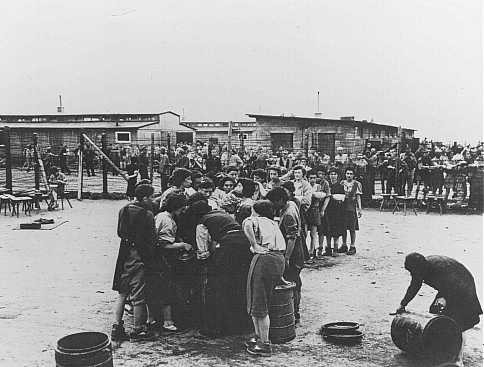 After liberation by US troops, former prisoners wait in line for soup. [LCID: 45035a]