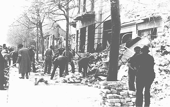 Jews forced to clear rubble from streets following the bombardment of Belgrade. [LCID: 85186]
