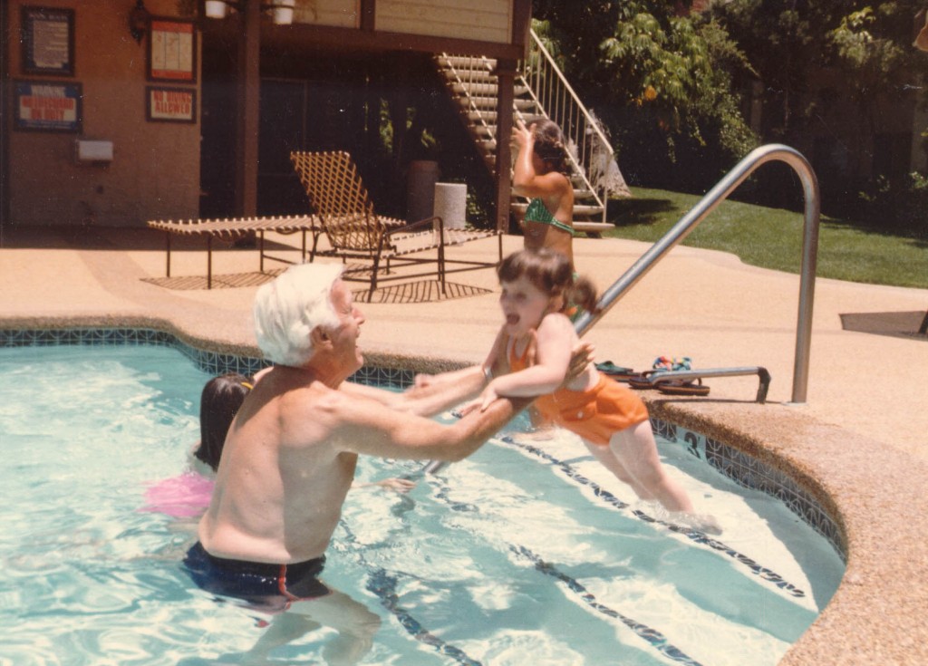 Harry teaching granddaughter Alexis Danielle how to swim, probably in San Diego, California. [LCID: roth16]