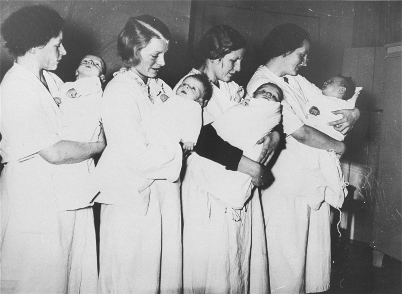Mothers who have given birth in a National Socialist maternity home wait to have their babies examined by a doctor. [LCID: 69496]