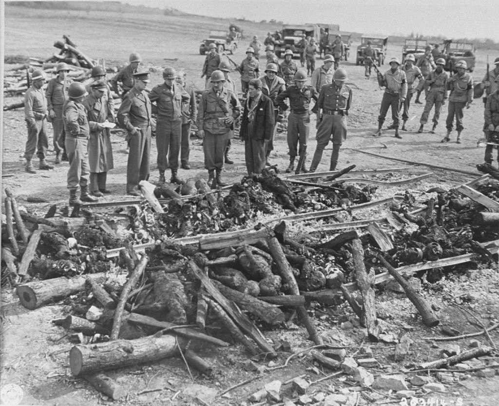 General Dwight D. Eisenhower (third from left) views the charred remains of inmates of the Ohrdruf camp. [LCID: 77811]